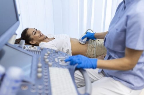 Sonographer Testing Female Patient's Stomach